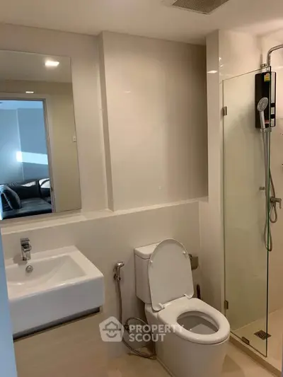 Modern bathroom with glass shower and sleek fixtures