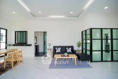 Spacious modern living room with sleek furniture and open layout