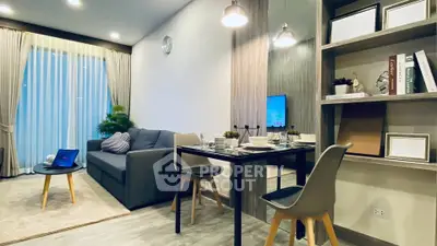 Modern living room with stylish decor and dining area, featuring cozy sofa and elegant lighting.