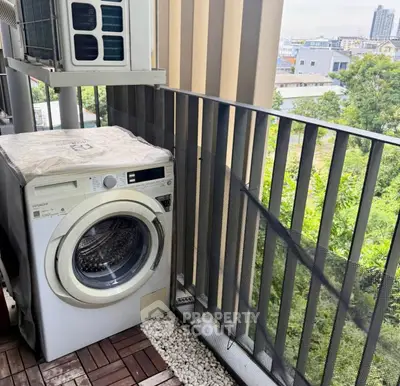 Modern balcony with washing machine and scenic view in urban apartment