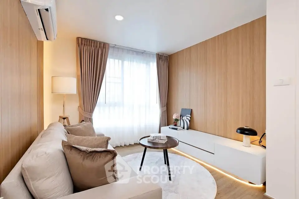 Modern living room with stylish decor, featuring a cozy sofa, elegant curtains, and ambient lighting.