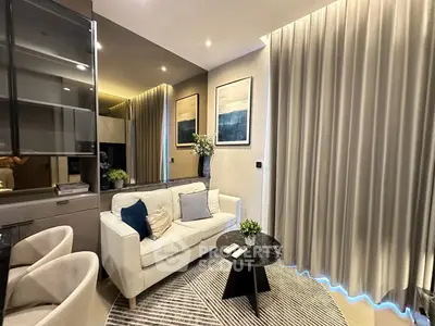 Modern living room with stylish decor, cozy sofa, and elegant lighting in a contemporary apartment.