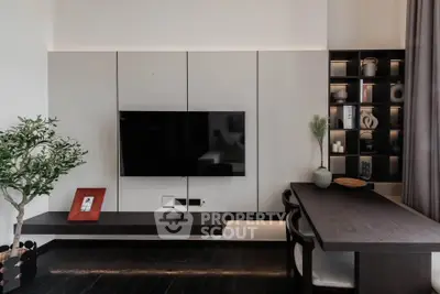 Modern living room with sleek TV setup and stylish shelving