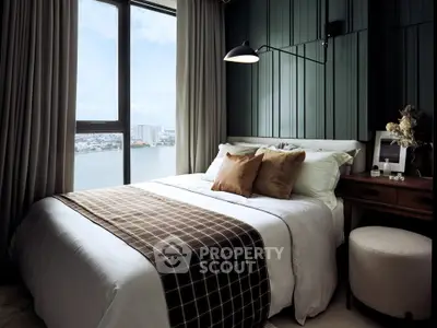 Luxurious bedroom with stunning city view, elegant decor, and cozy ambiance.