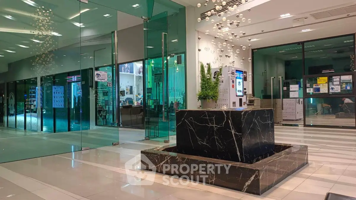 Modern building entrance with sleek glass doors and stylish marble decor