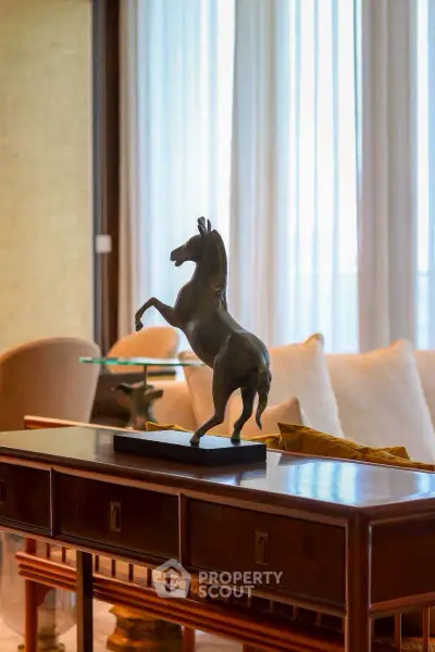Luxurious living room with elegant decor and horse sculpture centerpiece