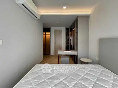 Modern bedroom with air conditioning and stylish decor in a contemporary apartment.