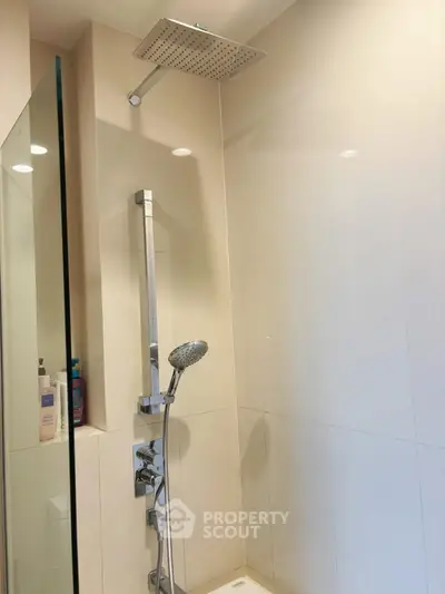 Modern bathroom with sleek shower fixtures and rainfall showerhead