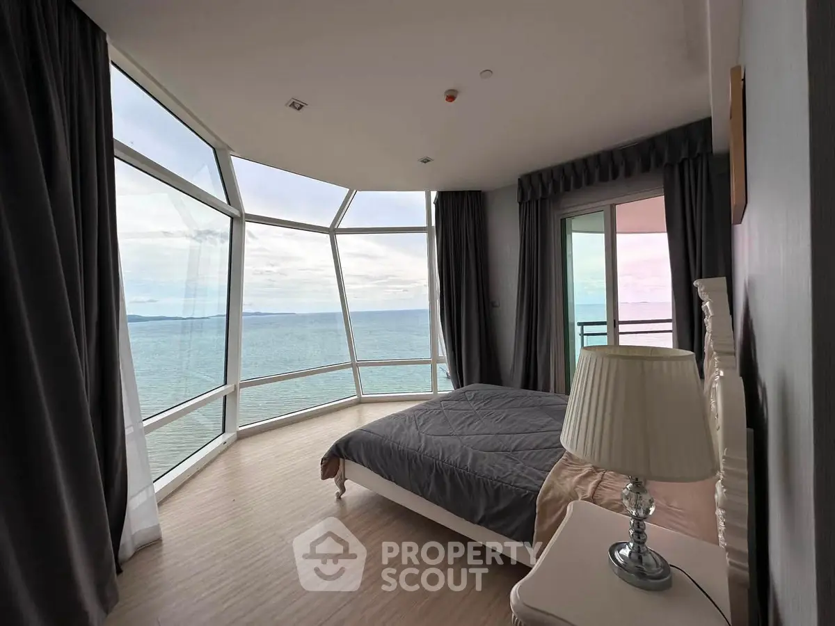 Stunning bedroom with panoramic ocean view and modern decor