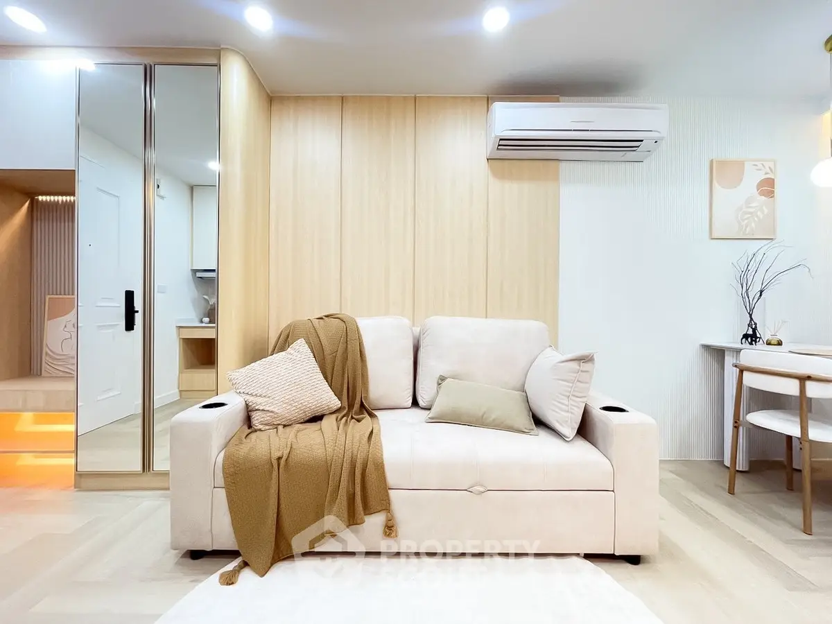 Modern living room with stylish beige sofa and elegant decor