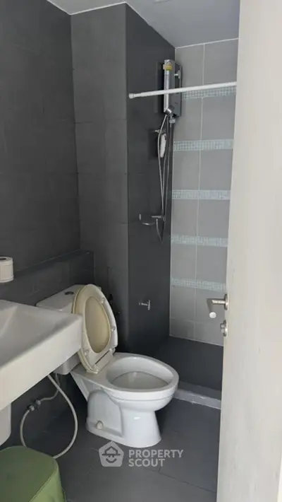 Modern bathroom with sleek gray tiles and contemporary fixtures