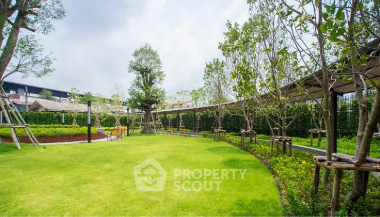 Lush green garden with well-maintained lawn and trees in a serene residential area.