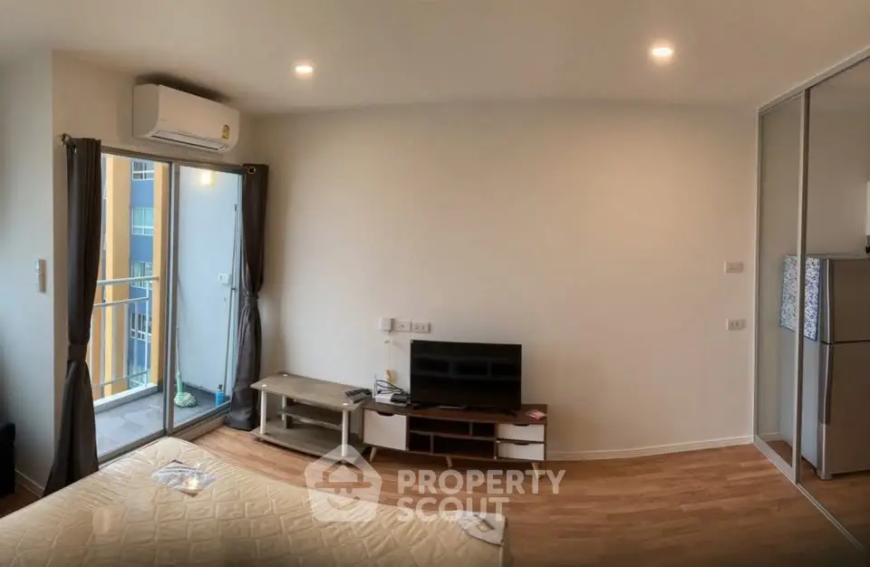 Modern bedroom with balcony access and sleek interior design