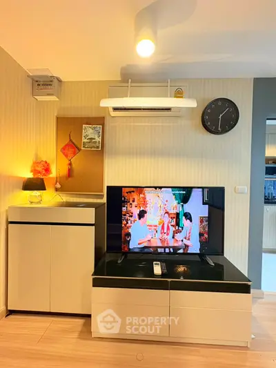 Modern living room with stylish TV setup and elegant lighting