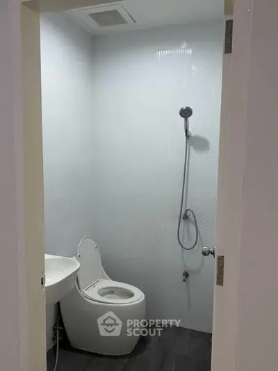 Modern minimalist bathroom with sleek fixtures and contemporary design.