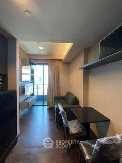 Modern living room with balcony and sleek furniture in a high-rise apartment