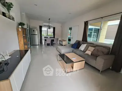 Spacious modern living room with stylish furniture and large windows