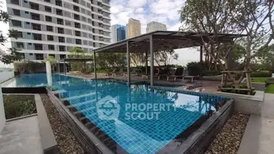 Luxurious rooftop pool with city views in modern residential complex