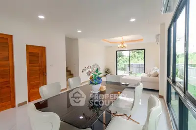 Spacious modern dining room with elegant table and garden view