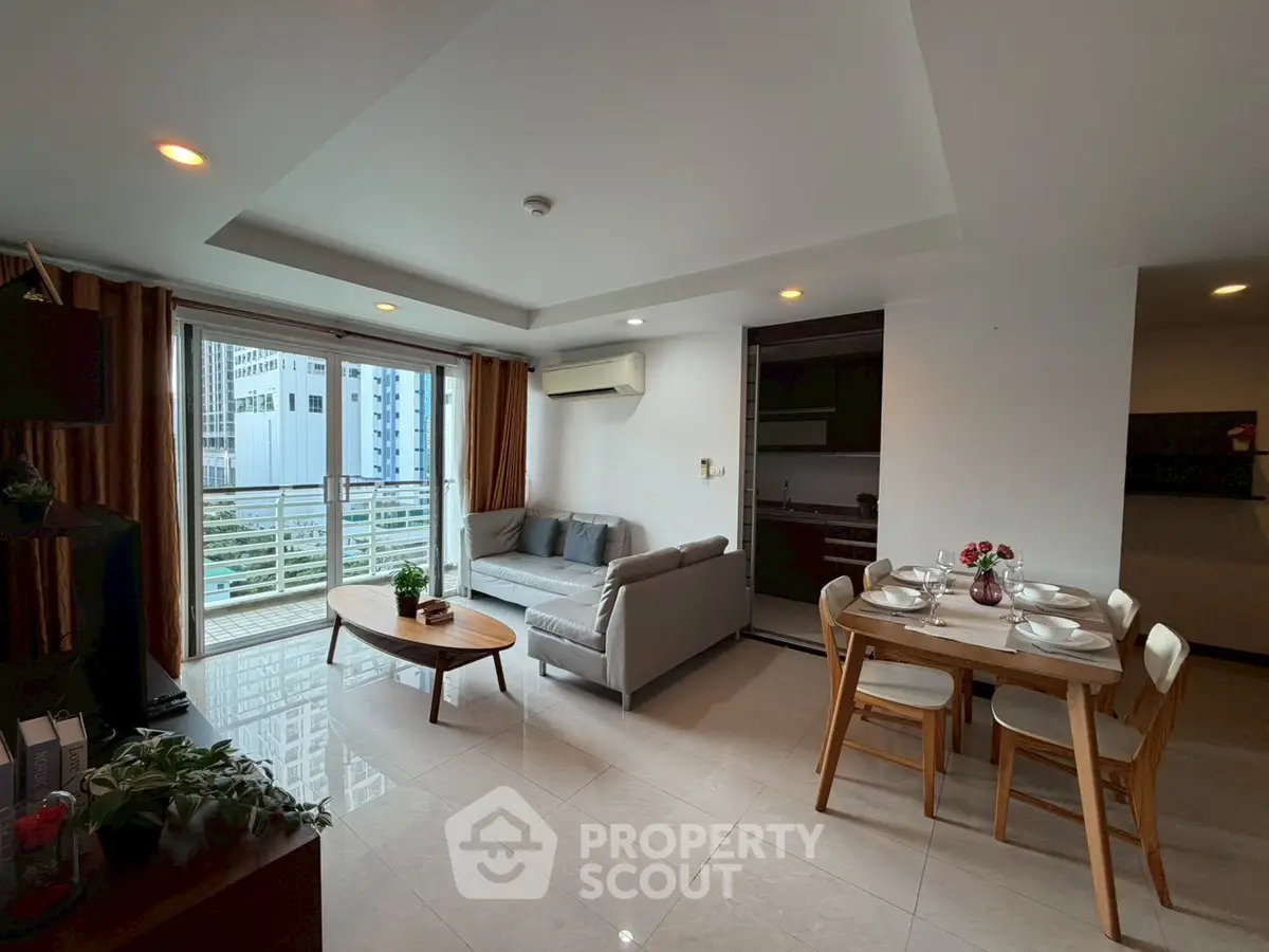 Spacious living room with balcony in modern apartment