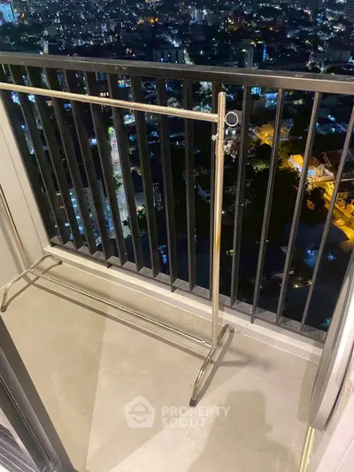 Chic balcony with stunning city night view, perfect for relaxation and enjoying urban skyline.