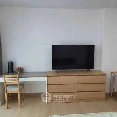 Modern living room with sleek TV setup and stylish furniture