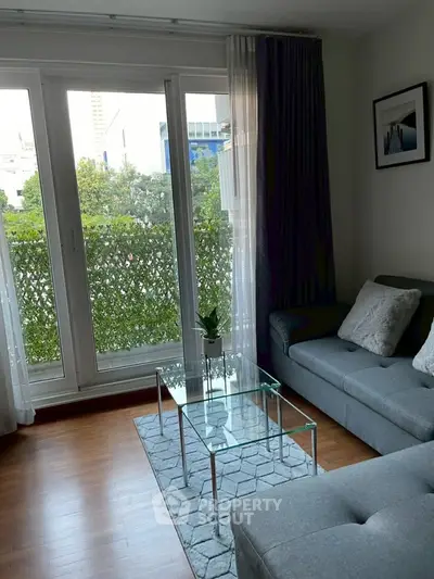 Modern living room with large windows and stylish decor in urban apartment