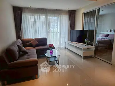 Modern living room with sleek furniture and large windows for natural light