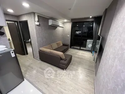 Modern living room with sleek design and balcony view