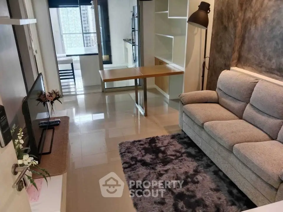 Modern living room with cozy sofa and stylish decor in a high-rise apartment