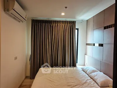 Modern bedroom with elegant curtains and air conditioning unit