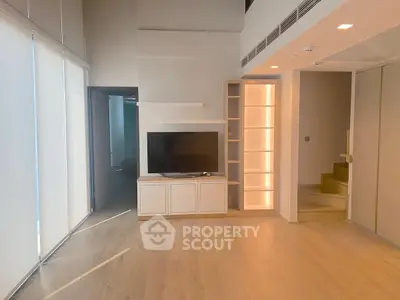 Spacious modern living room with sleek design and natural light