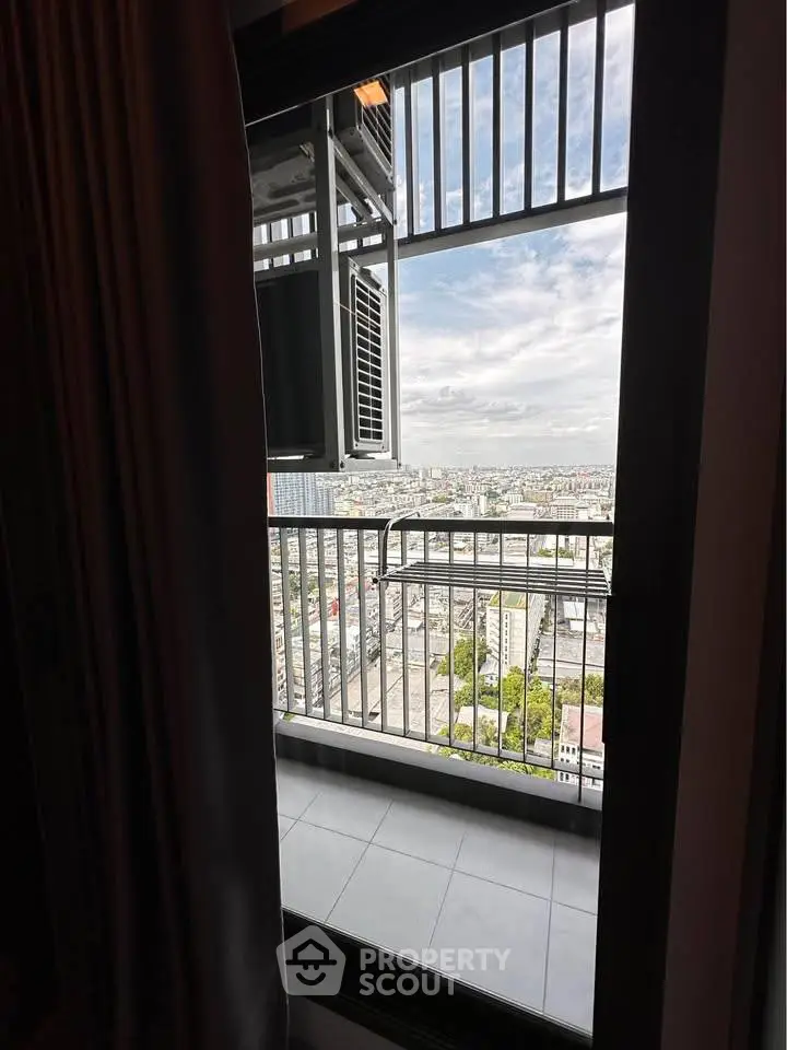 Stunning cityscape view from a high-rise balcony, perfect for urban living enthusiasts.