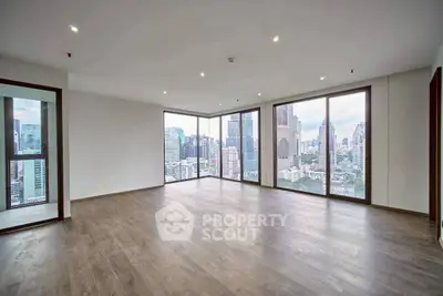 Spacious corner unit with stunning city view and floor-to-ceiling windows in modern high-rise.