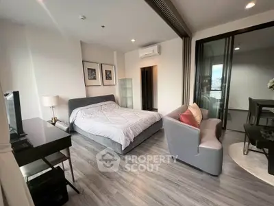 Modern bedroom with stylish decor and city view balcony