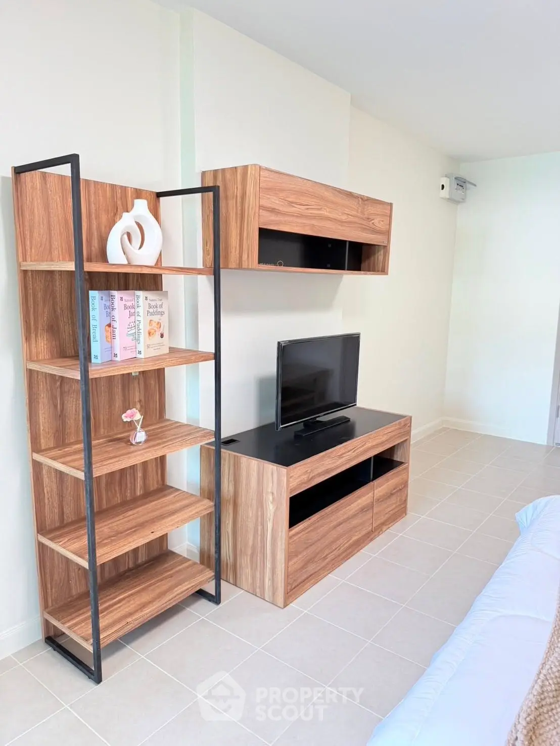 Modern living room with stylish wooden shelves and TV unit