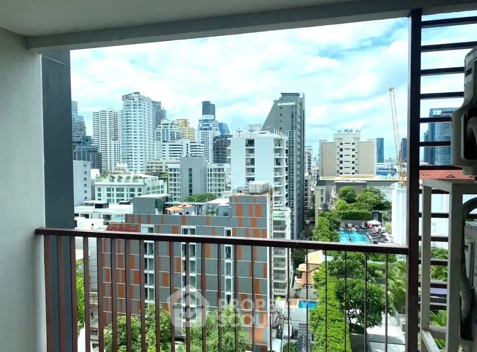 Stunning cityscape view from a modern apartment balcony in a high-rise building.
