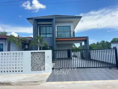 Modern two-story house with sleek design and spacious driveway