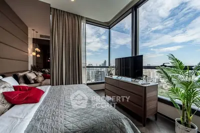 Luxurious bedroom with panoramic city views and modern decor