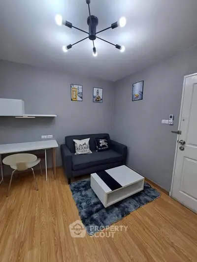 Modern living room with stylish decor and cozy seating area, perfect for relaxation and entertainment.
