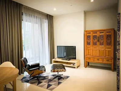Stylish living room with modern furniture and large window, perfect for relaxation and entertainment.