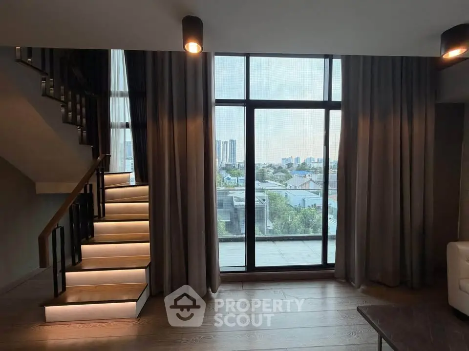 Luxurious living room with stunning city view and elegant staircase