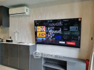 Modern living room with wall-mounted TV and sleek cabinetry