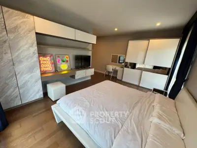 Modern bedroom with stylish decor and ample storage space