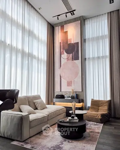 Luxurious modern living room with high ceilings and elegant decor