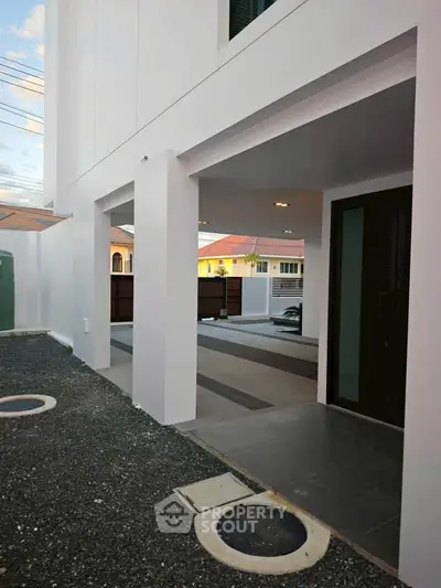 Modern minimalist exterior with sleek design and open entrance