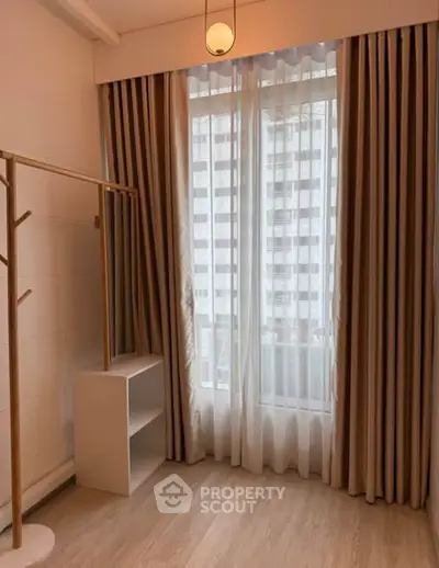 Cozy bedroom with elegant curtains and natural light