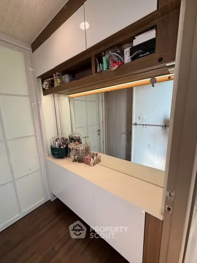 Stylish modern storage area with sleek cabinetry and ample space for organization.