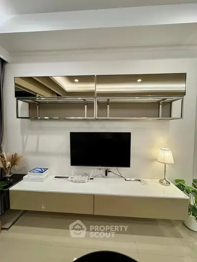 Modern living room with sleek TV unit and ambient lighting