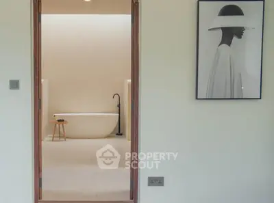 Elegant bathroom with modern freestanding bathtub and minimalist decor